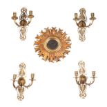 A set of four gilt brass rococo style twin-arm wall sconces, each 30cms high; together with a gilt