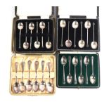 A set of six Mappin & Webb silver coffee spoons, 46g; a set of six silver coffee bean coffee spoons,