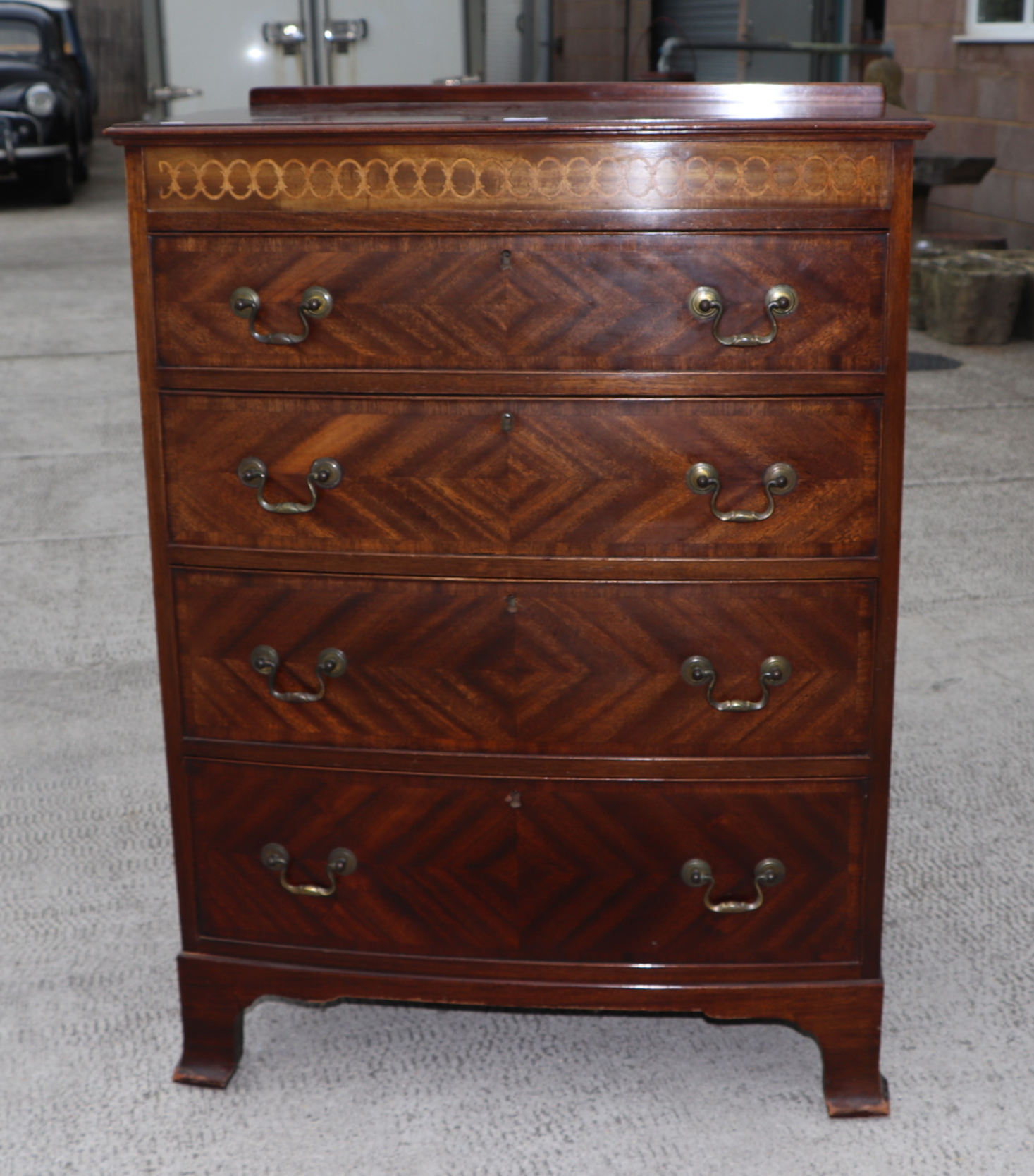 An Edwardian mahogany chest of four graduated long drawers, on bracket feet, 76cms wide. Condition - Image 4 of 13