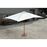 A very large Rusco garden parasol and stand. max diameter 480cm Condition Report Good overall