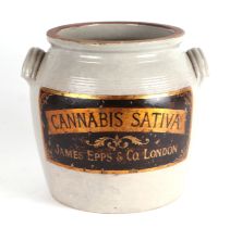 A contemporary apothecary pottery jar with applied lettering 'Cannabis Sativa, James Epps & Co.