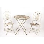 A French style three piece painted metal patio set comprising a table, 70cms diameter, and two
