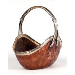 An Arts & Crafts style copper and silver plated handled basket, 35cms high.