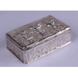 A late Victorian silver snuff box with repousse decoration to the lid and sides, the lid decorated