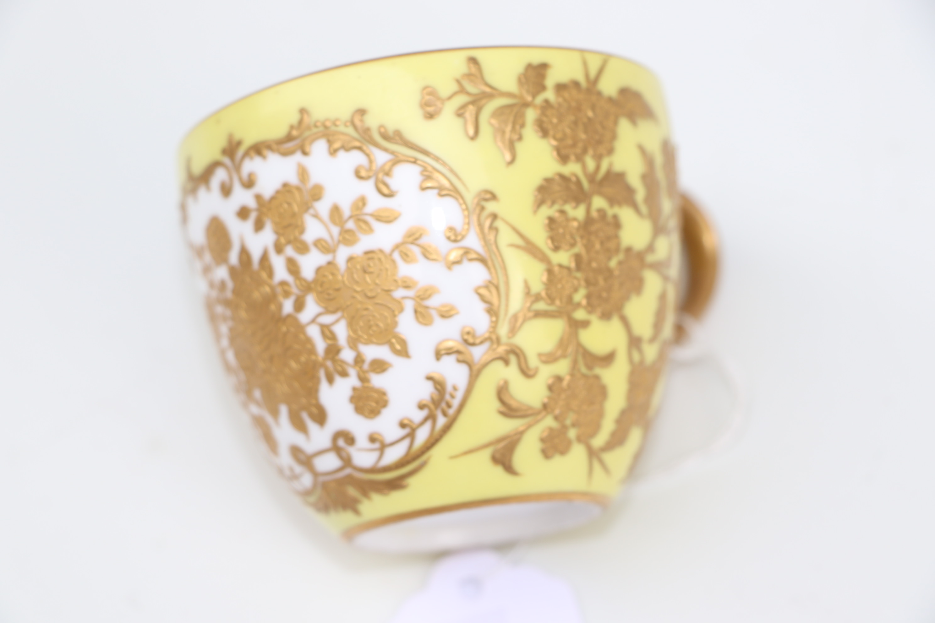 A pair of Derby cabinet cups and saucers decorated with gilded flowers, on a yellow ground; together - Image 6 of 10