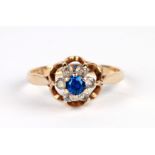 A 9ct gold cluster ring set with blue & white stones, approx UK size 'L', 1.6g.