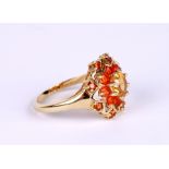 A 9ct gold cluster ring set with pale yellow and orange stones, approx UK size 'P', 3.5g.