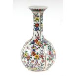 A Chinese bottle vase decorated with birds and foliage, character mark to base. 17cm high