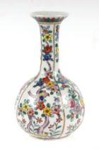 A Chinese bottle vase decorated with birds and foliage, character mark to base. 17cm high
