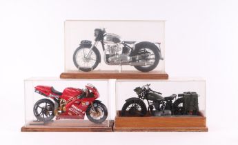 A 1:12 Ducatti racing motorcycle; a Triumph WWII Dispatch Rider's motorcycle and a Triumph Speed