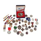 A tub of medals and medallions including: WW1 miniature medals, Korean War, Mountbatten of Burma,