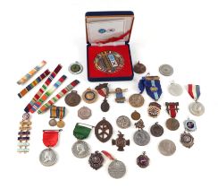 A tub of medals and medallions including: WW1 miniature medals, Korean War, Mountbatten of Burma,