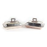 A pair of continental silver plated entree dishes and covers with gadrooned rims and cast handles (