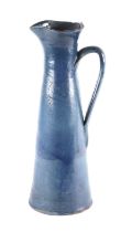 A large Claypits Ewenny Studio pottery ewer dated 1925, inscribed in Welsh 'Better Sensist Taste',