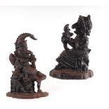 A pair of Victorian cast iron doorstops in the form of Punch and Judy, largest 30cms high (2).