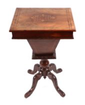 A Victorian walnut work table, the rectangular top with inlaid decoration opening to reveal a fitted