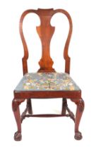 A George II walnut dining chair with vase shaped back splat and drop-in seat, on cabriole front legs