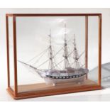 A Napoleonic War style prisoner of war three masted bone sailing ship, approx 42cms long, on a stand