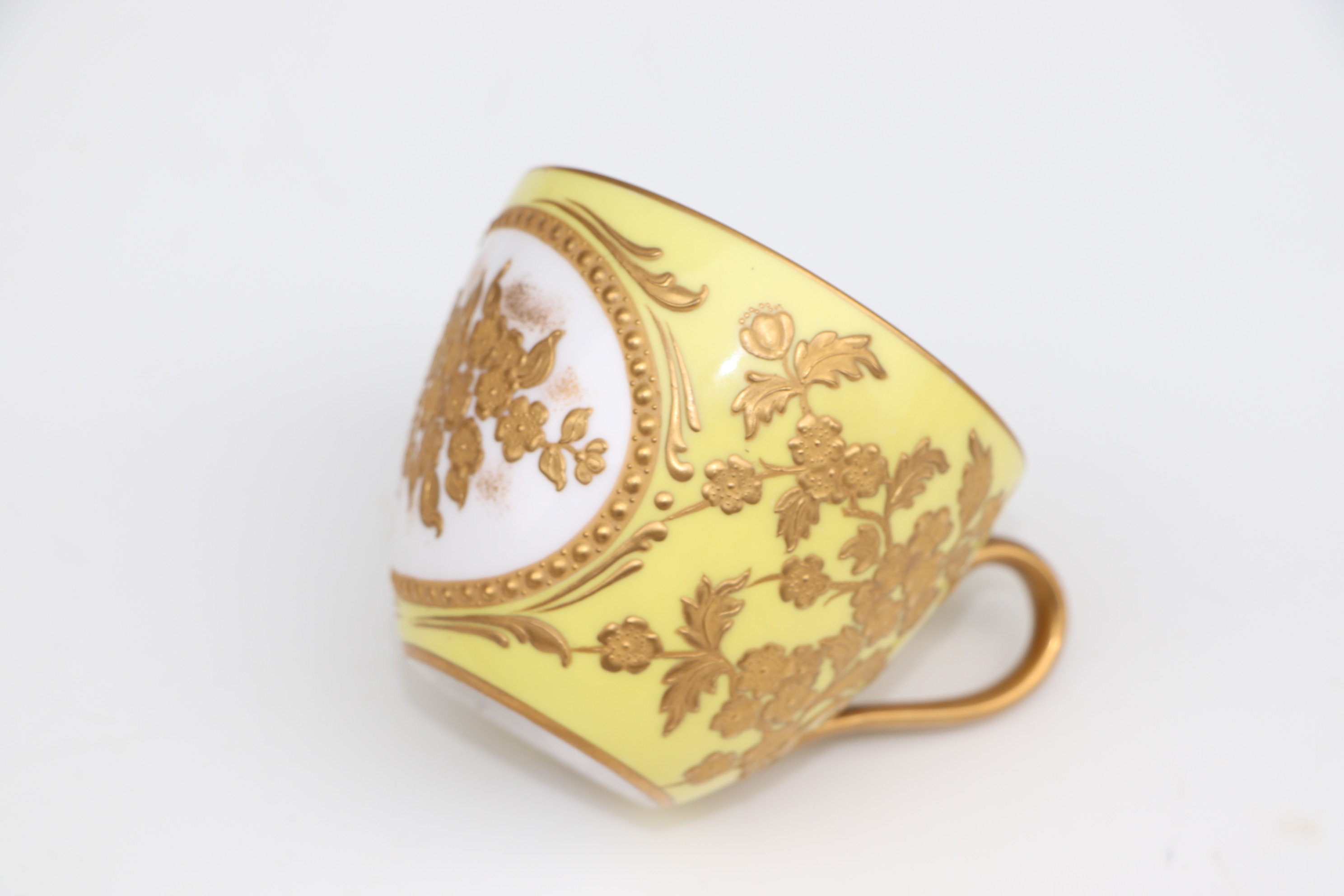 A pair of Derby cabinet cups and saucers decorated with gilded flowers, on a yellow ground; together - Image 2 of 10