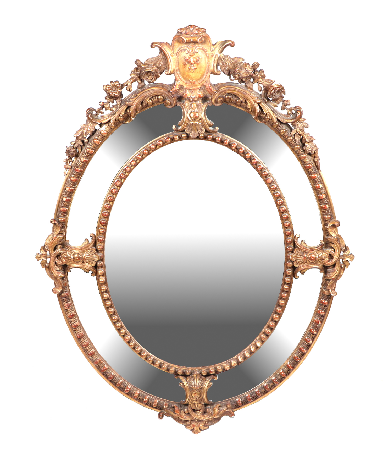 A 19th century carved giltwood and gesso oval wall mirror decorated with fleur de lys and swags