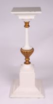 A French Empire style painted column, the pedestal with a stepped square base, 31cms wide.