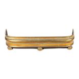 A Victorian brass fire curb on lion paw feet, 100cms wide.