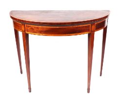A late 19th century Sheraton Revival mahogany D-end crossbanded card table, on tapering square legs,