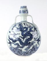 A Chinese blue & white moon flask decorated with dragons amongst clouds, 31cms high.