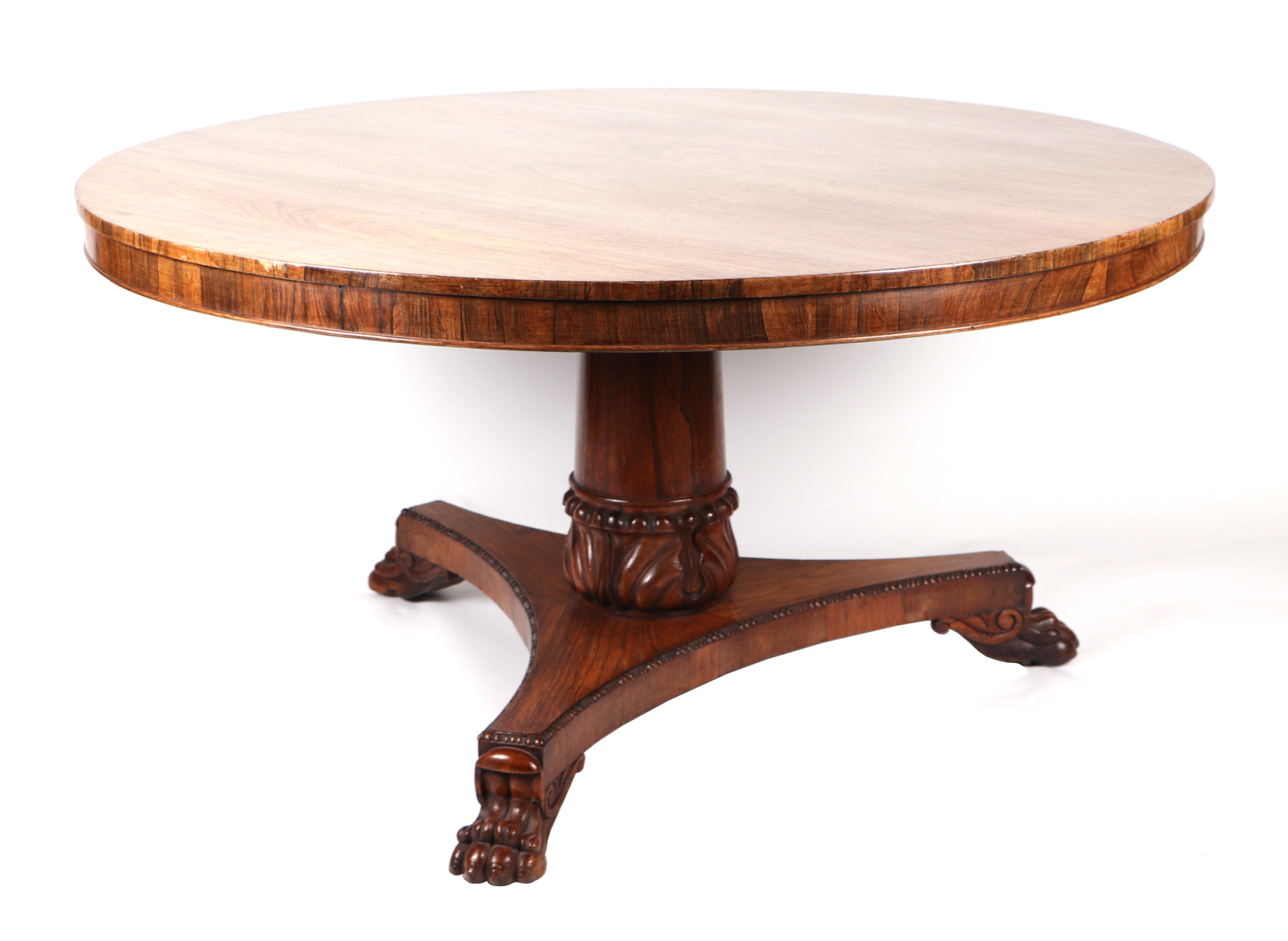 A 19th century rosewood centre table with circular tilt-top on a carved central column with