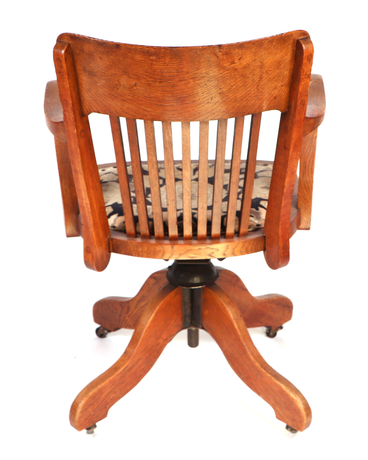 An early 20th century oak revolving desk chair by Cooke's of Finsbury. - Image 5 of 5