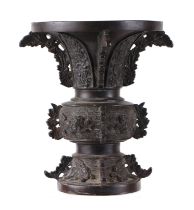 A Chinese bronze Gu vase of traditional form, 18cms high.