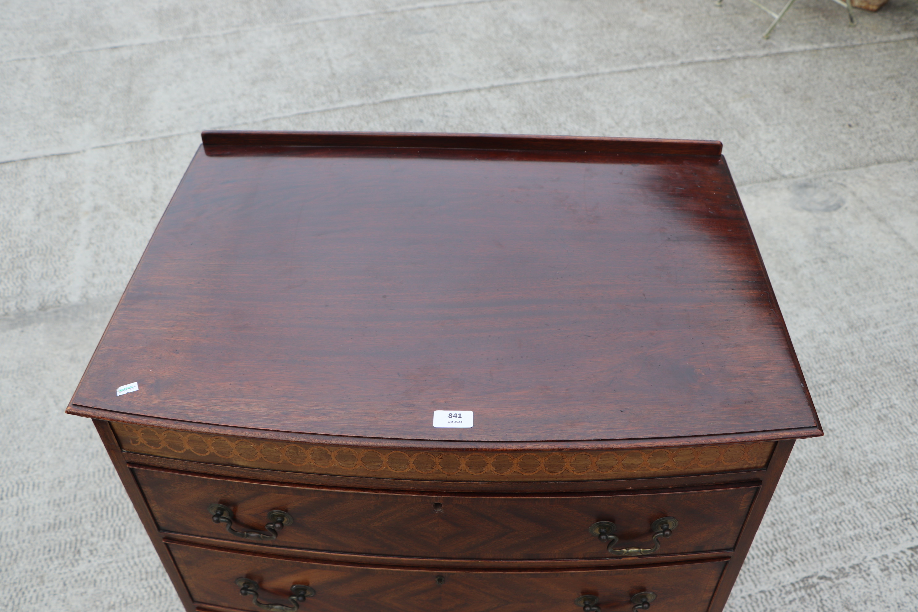 An Edwardian mahogany chest of four graduated long drawers, on bracket feet, 76cms wide. Condition - Image 7 of 13