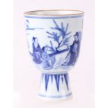 A Chinese blue & white stem cup decorated with figures in a landscape, 15.5cms high.
