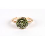 A 9ct gold cluster ring set with pale green stones, approx UK size 'P', 3.4g. Condition Report The