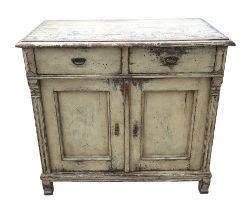 A late 19th century continental distressed painted pine cabinet with two frieze drawers above two