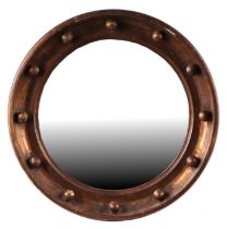 A Regency style circular gilt gesso bullseye wall mirror, 49cms diameter.