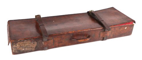 An early 20th century leather gun case with associated gun cleaning equipment, 32cms wide.