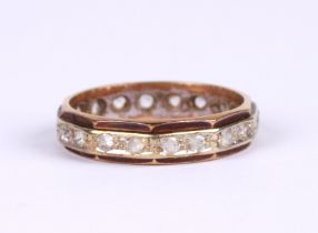 A 9ct gold eternity ring set with white stones (possibly white sapphire), approx UK size 'M', 2.6g.