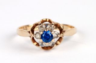 A 9ct gold cluster ring set with blue & white stones, approx UK size 'L', 1.6g.