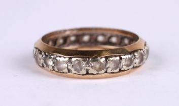 A 9ct gold eternity ring set with white stones (possibly white sapphire), approx UK size 'M', 2.7g.