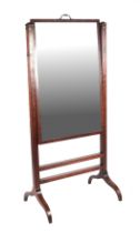 A 19th century mahogany Cheval mirror with rectangular rise-and-fall plate, on sabre legs, 72cms
