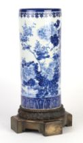 A late 19th century blue & white Japanese Seto cylinder vase on a bronze base, 36cms high.