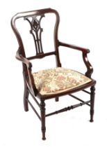 An Edwardian inlaid walnut elbow chair with upholstered seat.