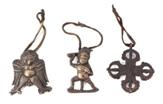 A group of three Tibetan pendants, each approx 6cms high (3).