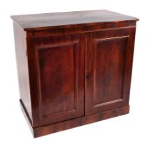 A Victorian mahogany cabinet, the pair of fielded panelled doors enclosing a fitted interior of