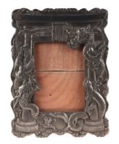 A Japanese Antimony mirror or photo frame decorated in relief with dragons, image window 9 by 13cms,