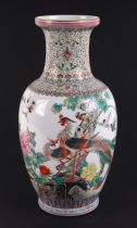 A Chinese Republic style famille rose baluster vase decorated with birds, foliage, and