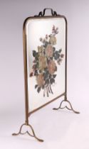 A brass fire screen with mirrored plate decorated with a spray of roses, 49cms wide.