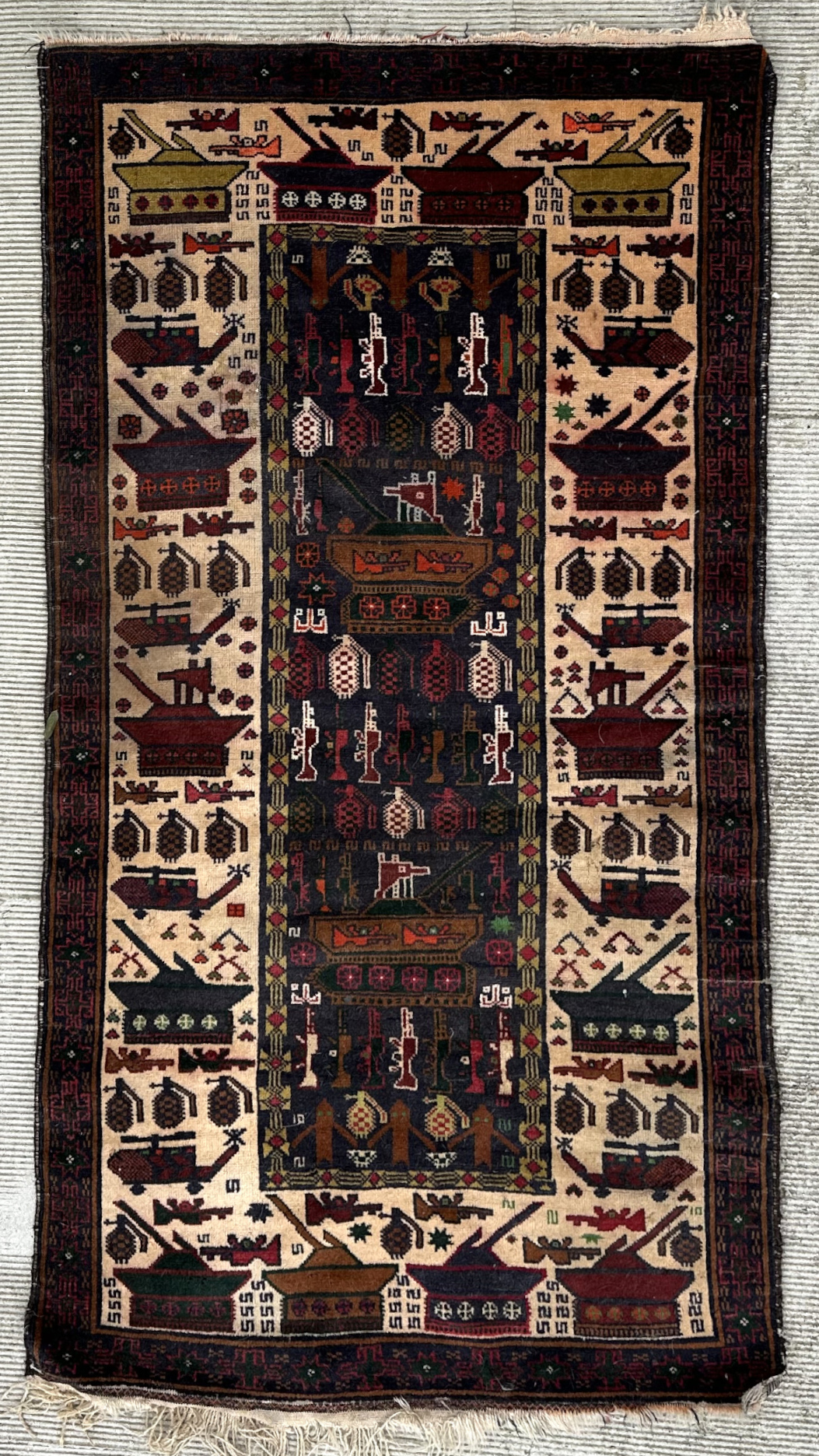 A Persian Afghan war rug with repeating motifs, on a blue and cream ground within a multi border,