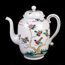 A Chinese famille rose teapot decorated with birds amongst flowering foliage, character mark to